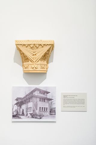Clay architectural design above an old photo of a double story house designed by Frank Lloyd Wright.