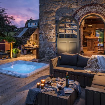 exterior of house with swimming pool and wooden flooring