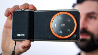 Xiaomi 14 Ultra phone being held by reviewer Basil Kronfli