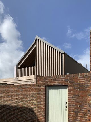 Exterior against blue skies of Deal house by Rupert Wheeler