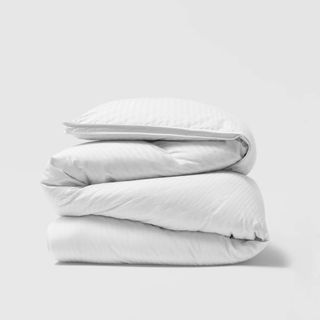 Riley Home White Goose Down Comforter against an off-white background.