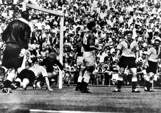 The Soviet Union (in darker shirts) take on Germany at the 1956 Olympics in Melbourne.
