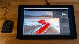 Huion Kamvas Pro 24 (4K) drawing tablet on a wooden surface
