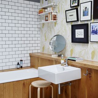 bathroom with washbasin and photoframe on wall