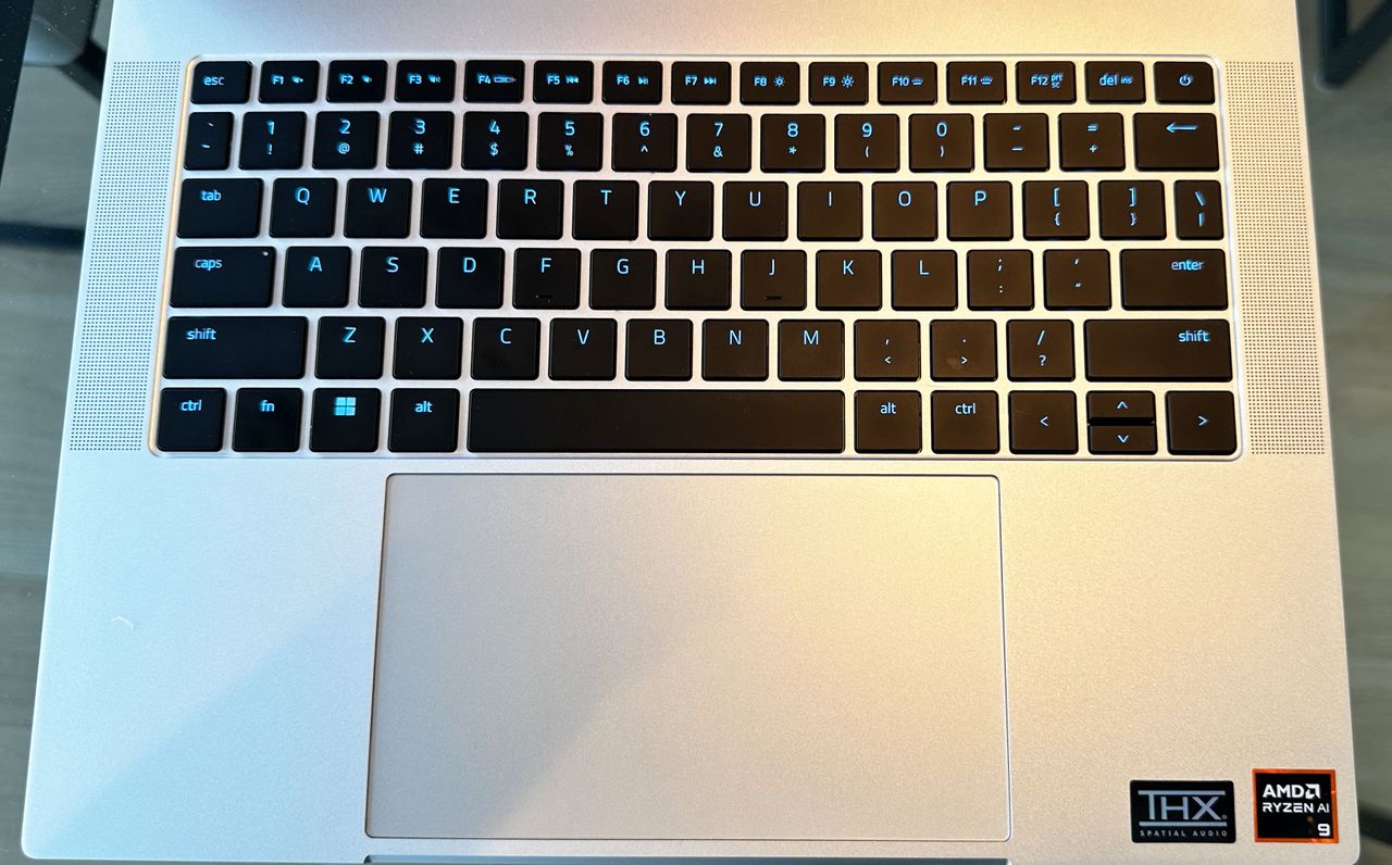 Top-down view of the Razer Blade 14 (early 2024) showing the keyboard and touchpad.