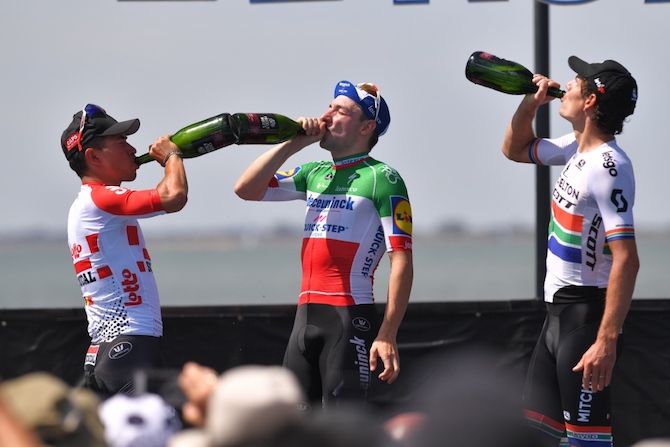It's a Champagne lifestyle for second-placed Caleb Ewan (Lotto Soudal), winner Elia Viviani (Deceuninck-QuickStep) and third-placed Daryl Impey (Mitchelton-Scott) after the 2019 Cadel Evans Great Ocean Road Race