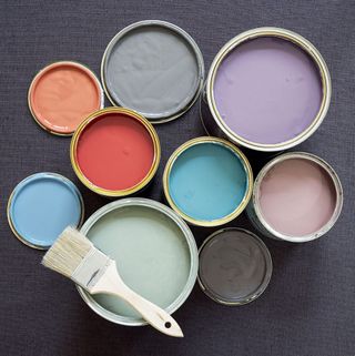 different colors of paints with painting brush