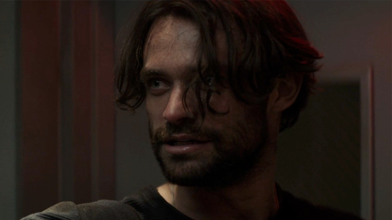 Thomas Doherty looking very serious with some bangs in front of his face in Paradise