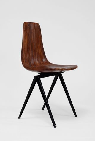 Chair with bent wooden seat and black metal legs by Sandrine Ébène de Zorzi