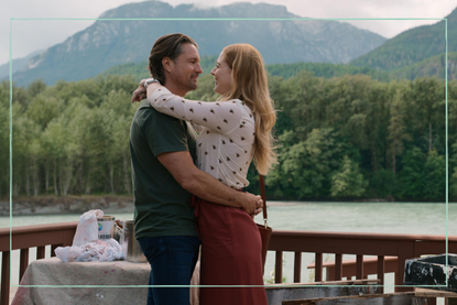 Alexandra Breckenridge and Martin Henderson embracing in a still from Virgin River season 4