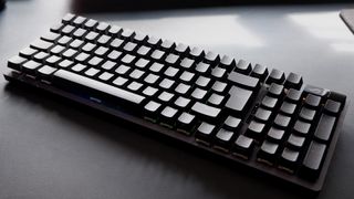 Asus ROG Strix Scope II 96 Wireless gaming keyboard on a desk.