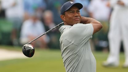Tiger Woods hits a drive during a 2023 Masters practice round