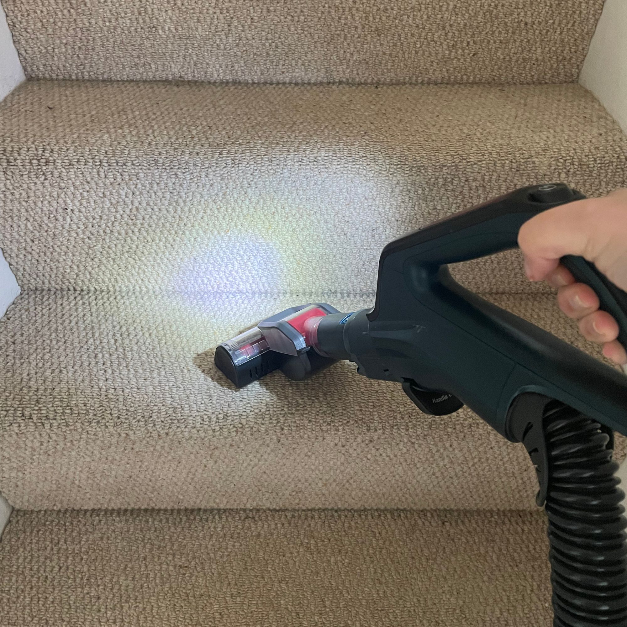 Using handheld pop-out of the Shark PowerDetect Powered Lift-Away Upright Pet Vacuum Cleaner AZ3900UKT to vacuum cream carpets