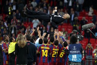 Barcelona coach Pep Guardiola is thrown into the air by his players after victory in the 2011 Champions League final