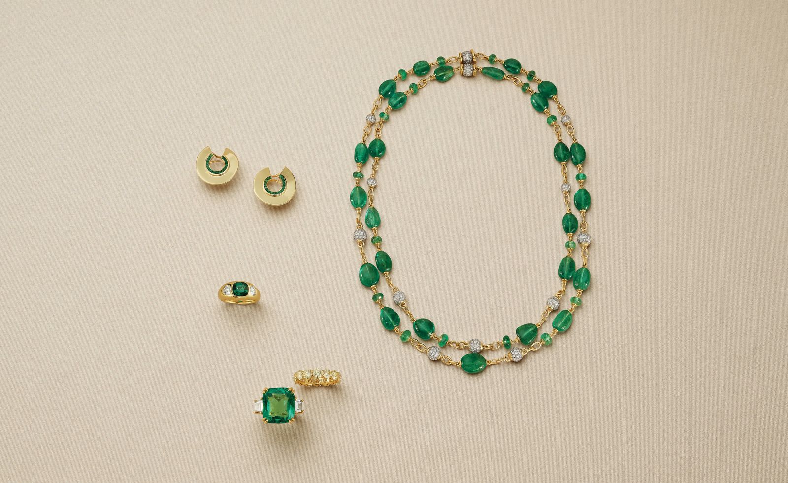 green necklace and rings