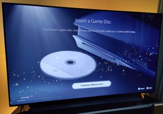 The PS5's insert disc screen shown on a gaming TV.