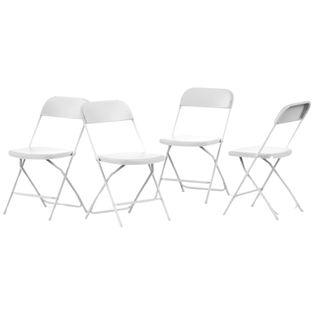 Four white folding chairs