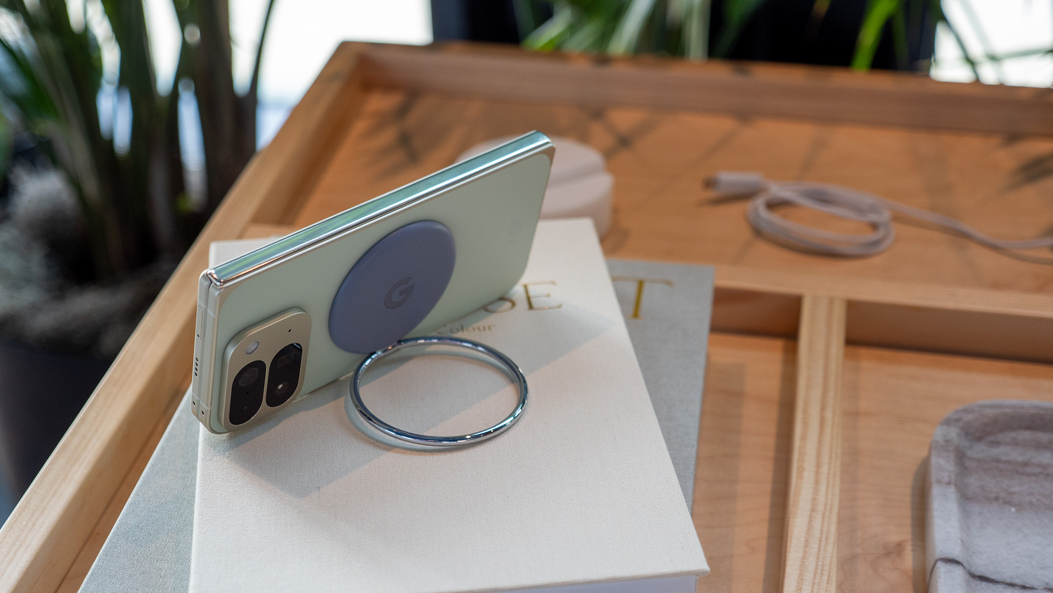 A Pixelsnap Ring on the back of a folded Google Pixel 10 Pro Fold