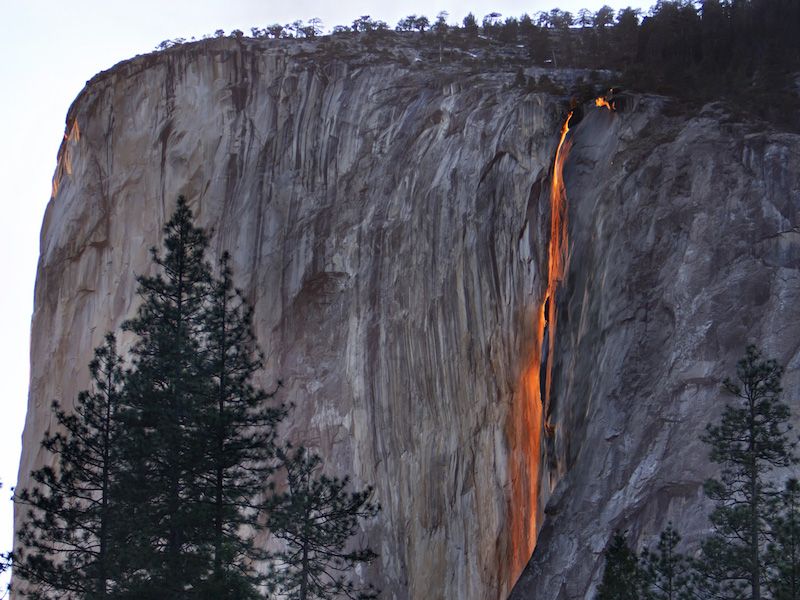 big sur waterfall glows like a river of fire