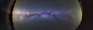 A large panoramic image composed of nine frames shows the long stretch of the Milky Way galaxy, as seen from the Northern Hemisphere in Portugal's Dark Sky Alqueva Reserve.