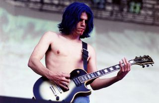 Adam Jones performs onstage with Tool in New York City on July 11, 1997