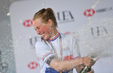 Alice Barnes sprays the champagne
