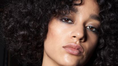 A model wearing waterline eyeliner poses backstage ahead of the White Sands show during Mercedes-Benz Fashion Week Australia Spring/Summer 2013/14 at Carriageworks on April 8, 2013 in Sydney, Australia. 