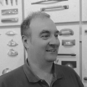 Mark jones, Owner of The Handle Studio, photographed in front of several handles