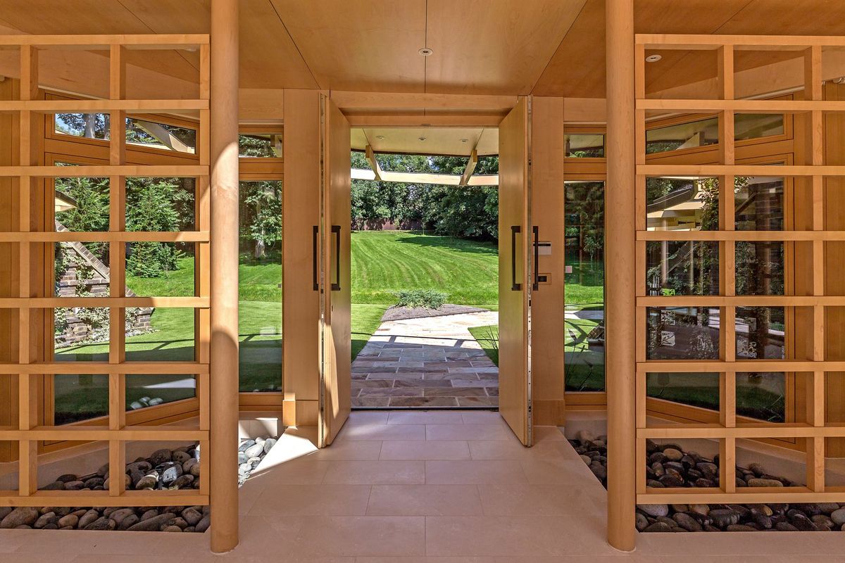 The glass atrium as seen up close with wood framing