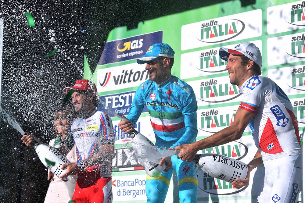 Vincenzo Nibali (Astana) sprays champagne from the podium at Tour of Lombardy