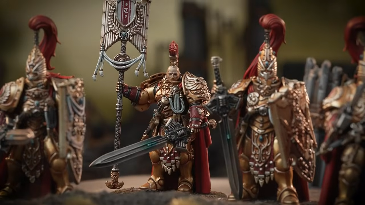 Warhammer Custodes miniatures on a blasted battleground