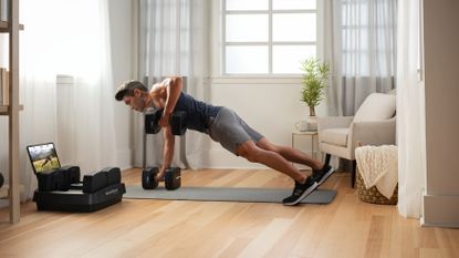 Man working out with the NordicTrack iSelect Adjustable Dumbbells