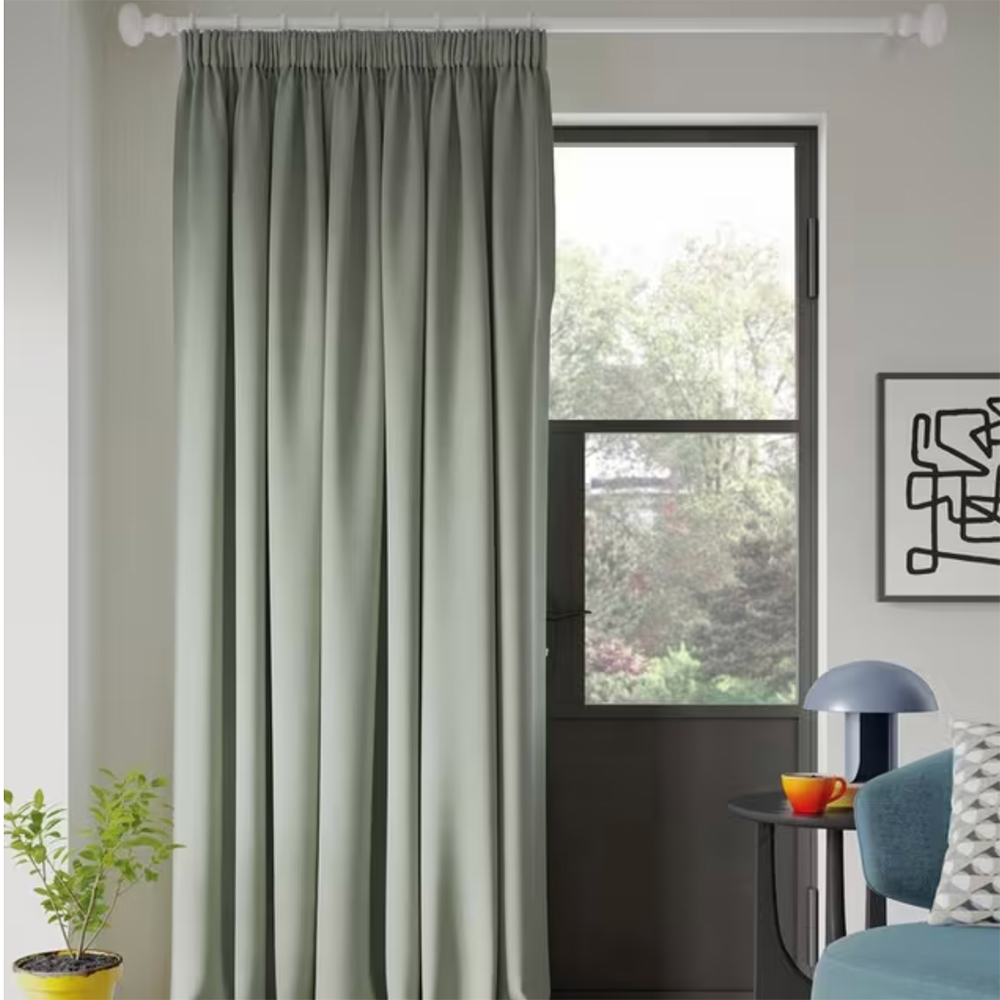 light green pleated door curtain hanging over a black door