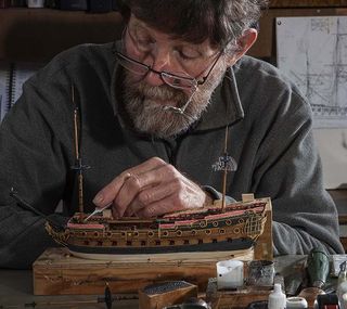 Model ship maker Philip Reed at his workshop above his house in Truro, Cornwall. © Richard Cannon / Country Life Picture Library