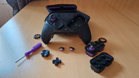 Victrix Pro BFG review image showing the various components and attachments of the gamepad set out on a table