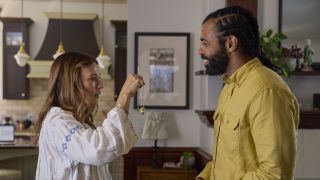 Claire (Rashida Jones) examines her present from Greg (Daveed Diggs) in In the Blink of an Eye.