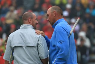 Thomas Bjorn shares commiserations and hair care tips with Craig Lee in Switzerland