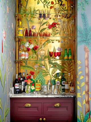 Bar area with a gold de Gournay wall mural