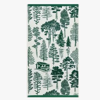 White bath towel with dark green tree and cottage print