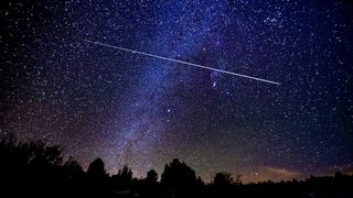 Meteor Shower with Milky Way Galaxy and Stars