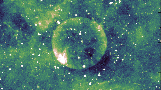 A green and blue scene with a circle outline in the center.