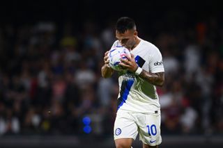 Lautaro Martinez kisses the match ball after scoring four goals for Inter away to Salernitana in September 2023.