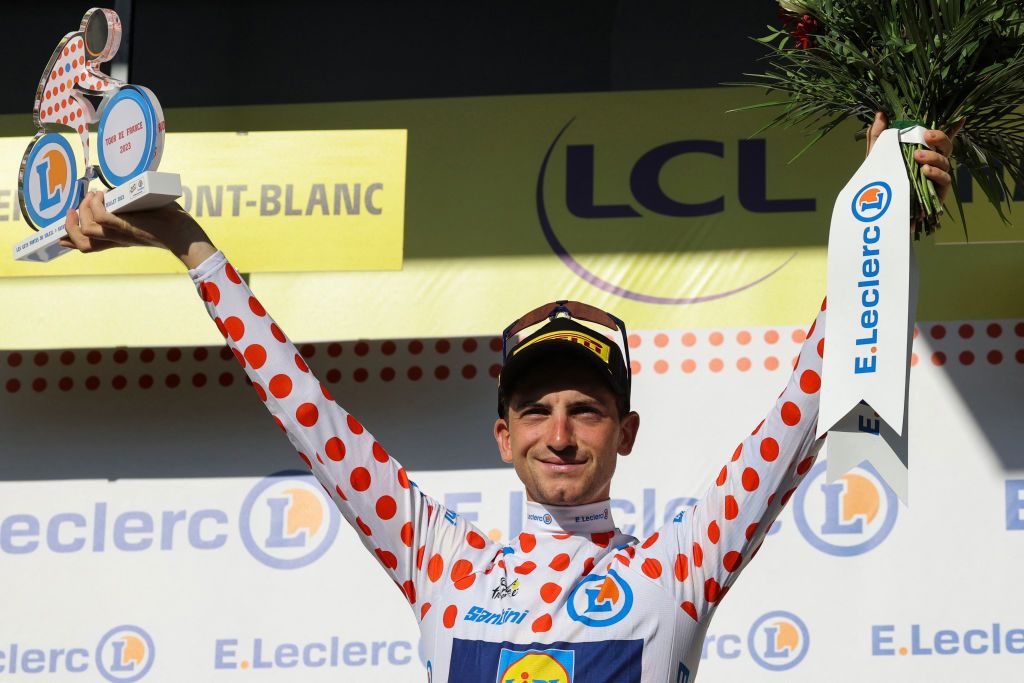 Lidl - Trek's Italian rider Giulio Ciccone celebrates on the podium with the best climber's polka dot (dotted) jersey after the 15th stage of the 110th edition of the Tour de France cycling race, 179 km between Les Gets Les Portes du Soleil and Saint-Gervais Mont-Blanc, in the French Alps, on July 16, 2023. (Photo by Thomas SAMSON / AFP)