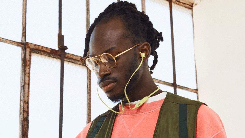 Beats Flex being worn by a man wearing glasses