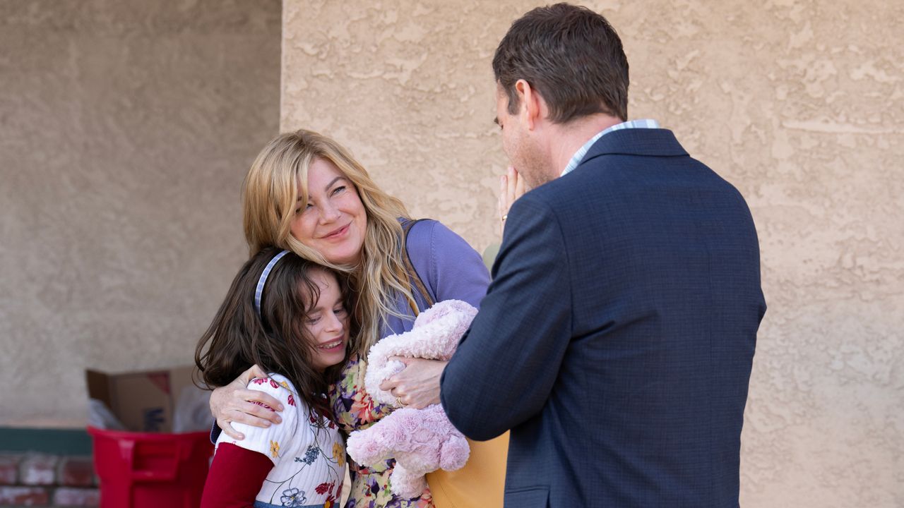 ellen pompeo as kristine barnett hugging her adoptive daughter natalia grace, played by imogen faith reid, while mark duplass as michael barnett looks on