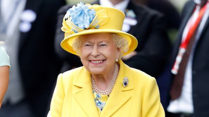 Queen Elizabeth II watches her horse 'Fabricate' run in the Wolferton Stakes