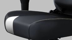 A close up of a black and white office chair from AndaSeat.