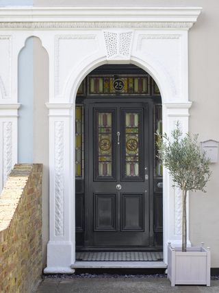 Black front door painted in Sandtex Rapid Dry Gloss paint