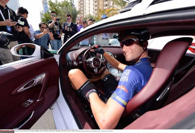 Taylor Phinney looks to make a quick exit in a police Bugatti
