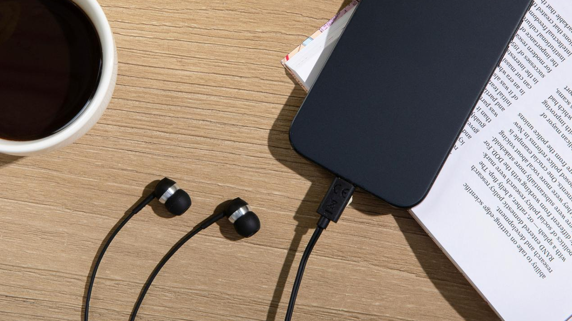 Sennheiser CX 80U wired in-ear headphones plugged into smartphone